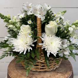White flowers arranged in a wicker basket