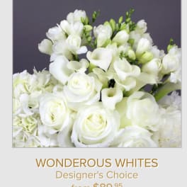 White roses and calla lilies in a designer's choice bouquet
