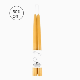 Pair of natural honey-colored taper candles bundled with a white label
