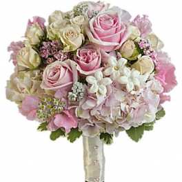 Pink and cream rose bouquet with hydrangeas and small white flowers