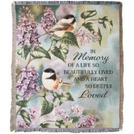 Memorial blanket with birds, lilac flowers, and a remembrance message