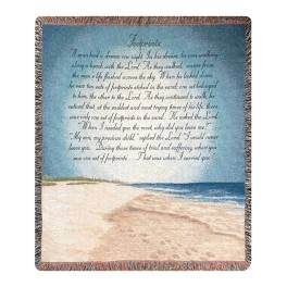 Woven blanket with a beach scene and printed text