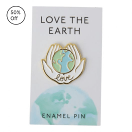 Enamel pin on a card reading "Love the Earth"