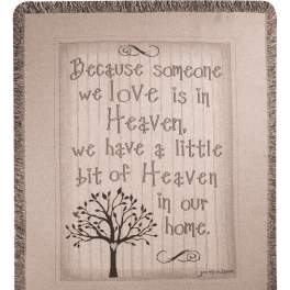 Fringed wall hanging with a quote and tree graphic
