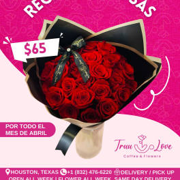 Bouquet of red roses wrapped in black paper with a ribbon
