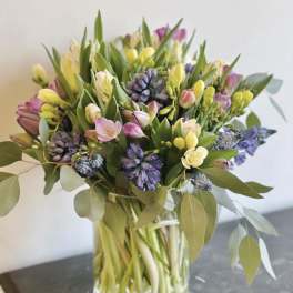 Mixed pastel bouquet in a clear glass vase