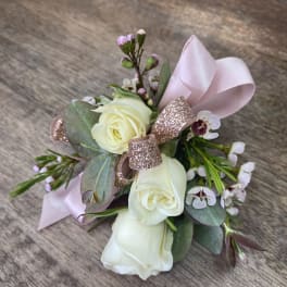 Small bouquet of white roses with pink ribbon and glitter bow