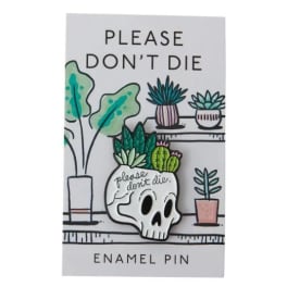 Enamel pin card with a skull planter and potted succulents