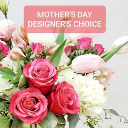 Pink roses and white tulips with a Mother's Day sign