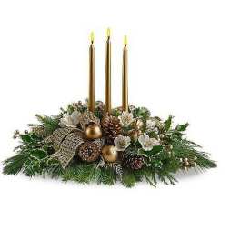 Low centerpiece with three gold candles, white flowers, pinecones, and gold ornaments