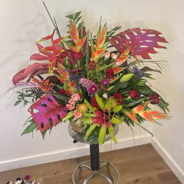A large Grand display of tropical blooms & cottage flowers