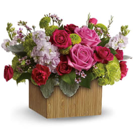 Mixed pink and red roses in a wooden box arrangement