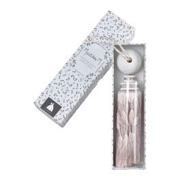 Decorative perfume bottle with tassel in a patterned gift box