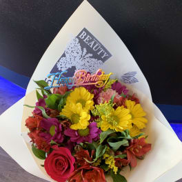 Mixed bouquet with a birthday topper in white wrap