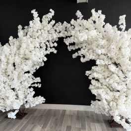 White flowering branches arranged in two arching displays