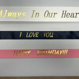 Decorative ribbons with gold lettering reading "I LOVE YOU" and "HAPPY BIRTHDAY!!!"