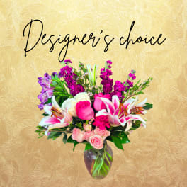 Mixed pink and white flower arrangement in a glass vase