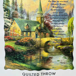 Quilted throw with a church scene and printed Lord's Prayer text