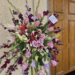 Violet memorial standing funeral spray