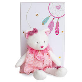 White teddy bear in a pink dress with a gift box behind it