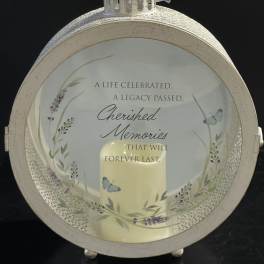 Decorative memorial lantern with a candle and butterfly design