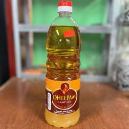 Bottle of lamp oil on a wooden table