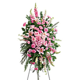Tall pink and white floral standing spray on an easel
