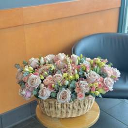large flower arrangement with roses and lisianthus