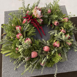Seasonal Protea wreath florist choice