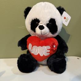 Plush panda holding a red heart with the word LOVE