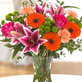 Vibrant Orange Gerbera Daisies, Pink lilies, carnations and more