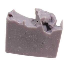 A lavender bar of soap with a rough, swirled top
