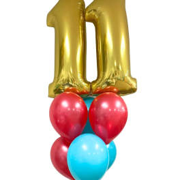 Gold number 1 balloon above a cluster of red and blue balloons