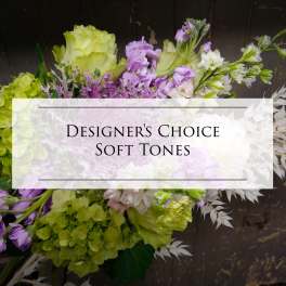 Soft-toned bouquet with green hydrangeas, lavender blooms, and white flowers