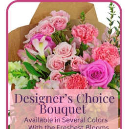 Pink mixed flower bouquet wrapped in brown paper