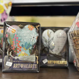 Gift box with a painted heart ornament and tassel