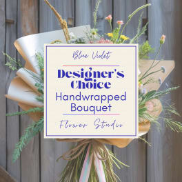 Handwrapped bouquet with mixed pastel flowers and tan paper