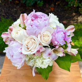 Pink and white bouquet in a glass vase