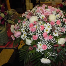 Large pink and white floral spray with ribbon accents