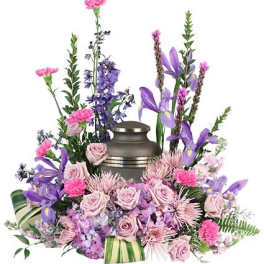 Floral funeral urn arrangement with pink and purple flowers