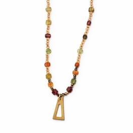 Beaded necklace with a gold pendant on a white background