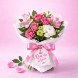 Pink rose bouquet with carnations and white blooms wrapped in white paper