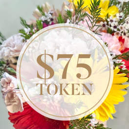 Mixed bouquet with bright gerbera daisies and small white filler flowers