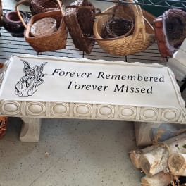 Memorial bench with angel graphic and the words Forever Remembered Forever Missed