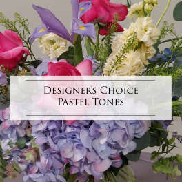 Pastel bouquet with pink roses, lavender irises, and cream flowers