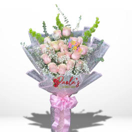 Pink rose bouquet with a birthday topper and pink ribbon
