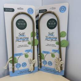 Packaged self-watering plant climbers with rope ties