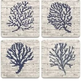 Set of four square coasters with navy coral designs on a whitewashed background
