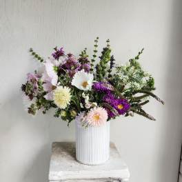 Mixed pastel bouquet in a white ribbed vase