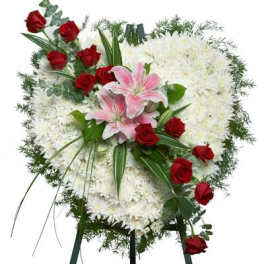 Standing floral spray with white flowers, red roses, and pink lilies
